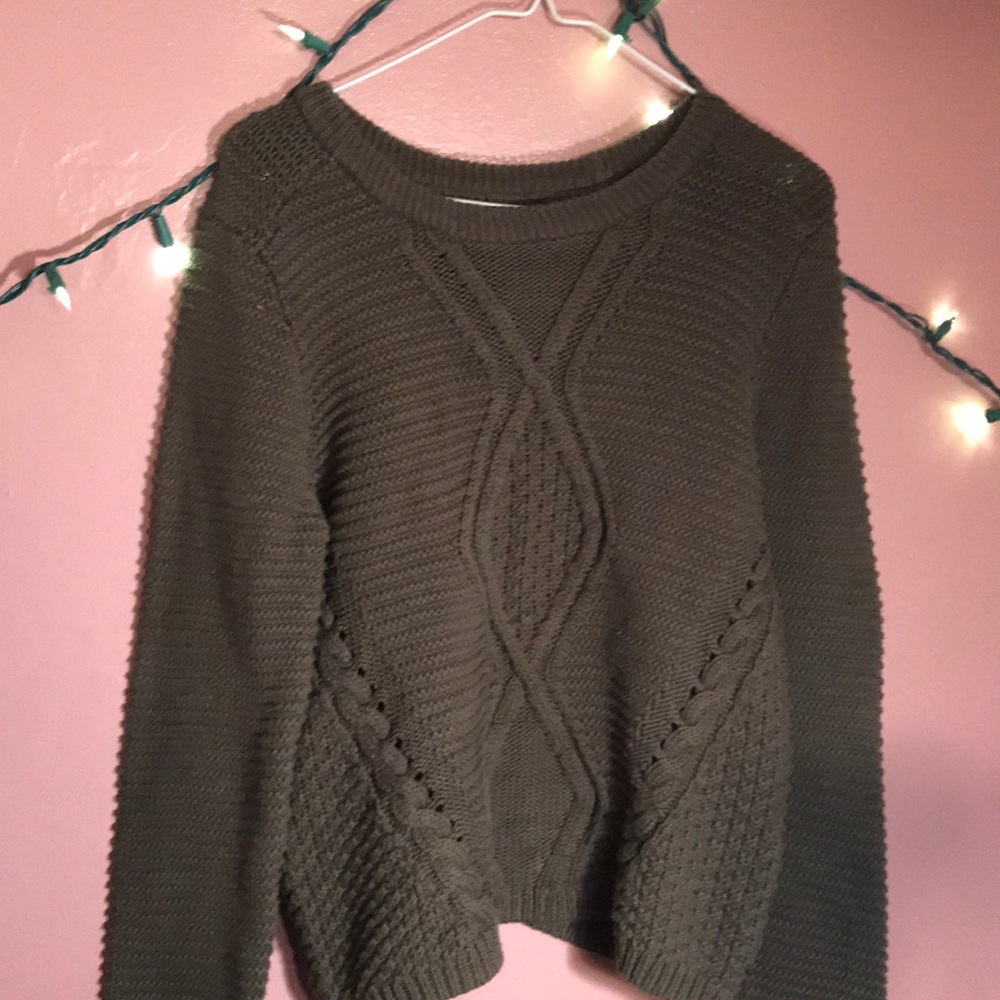 A green sweater